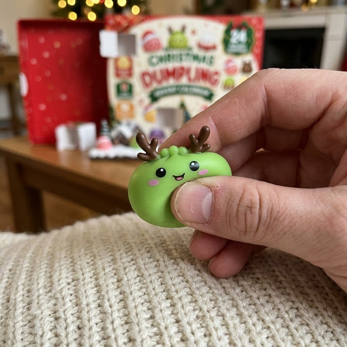 Hand squeezing a green dumpling squishy